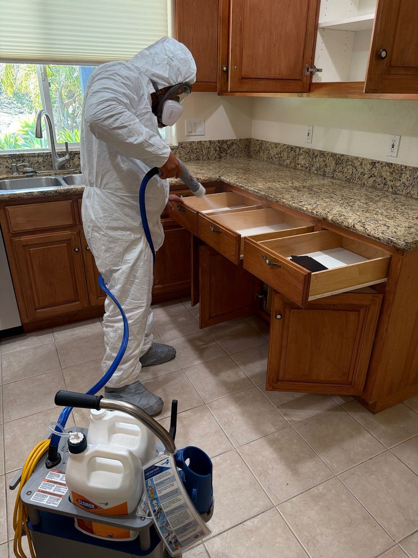 Resolve Residential Restoration technician in protective gear working inside a contained job site